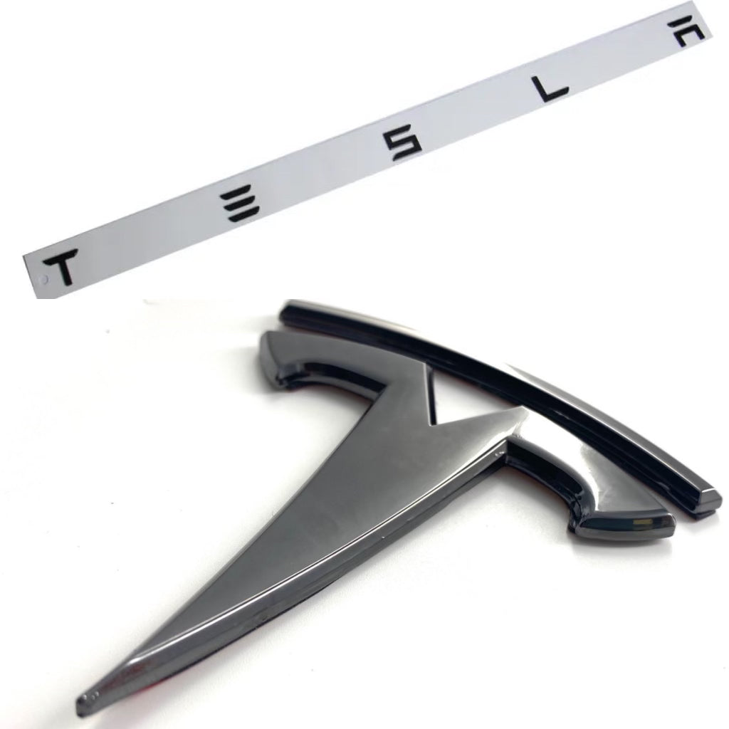 svart Tesla emblem bak