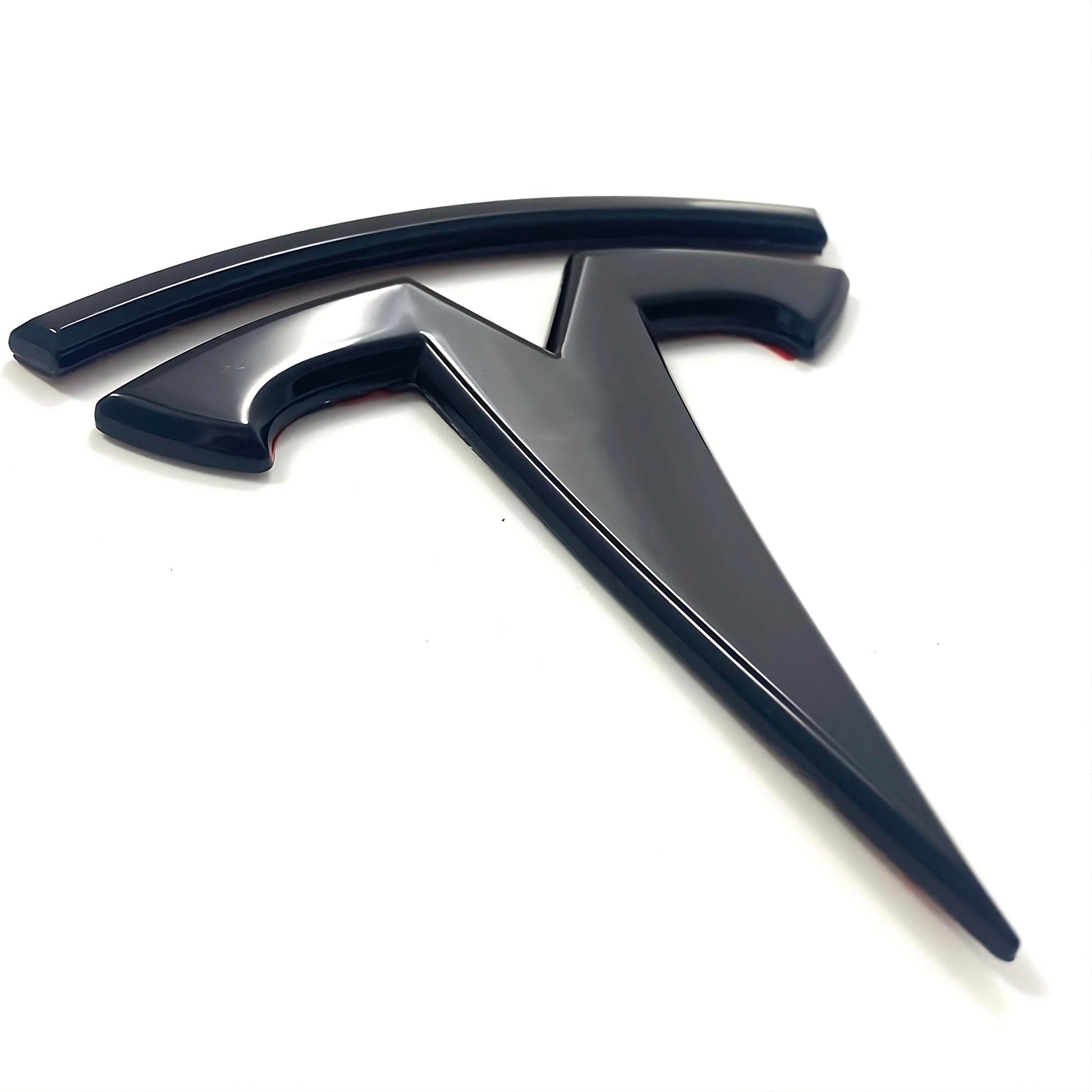 tesla emblem logga bak